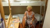 Louise models the bunk beds aboard the Blue Star ferry.